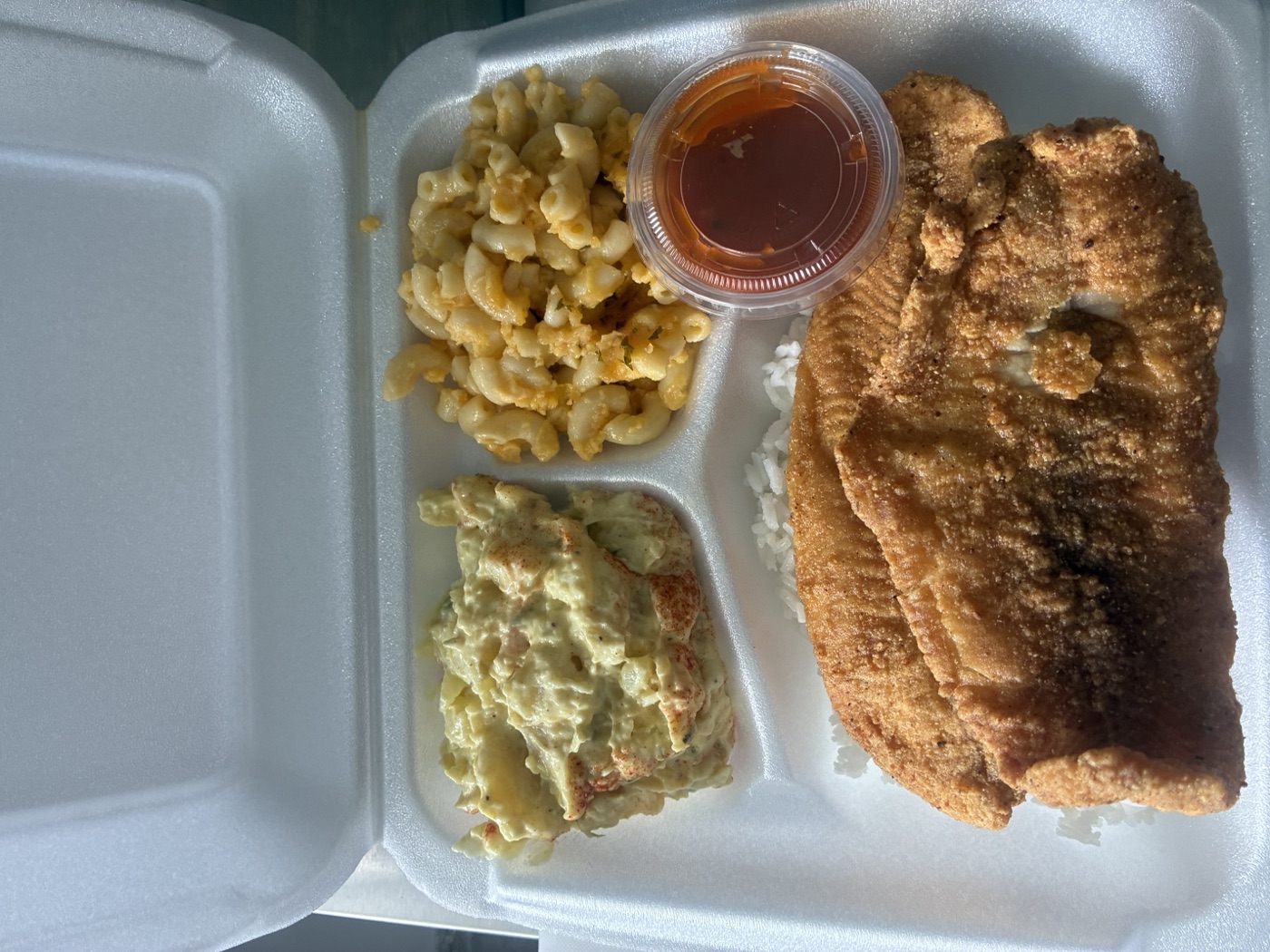 Fried Catfish Plate with mac & cheese, potato salad, rice and hot sauce